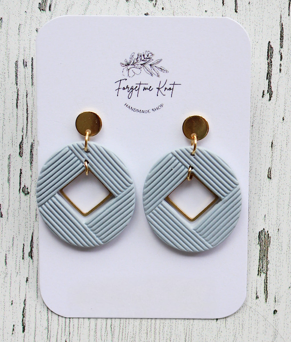 Boucles d'oreilles ovales bleu-gris insertion carrées